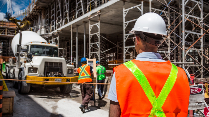 Project manager overlooking a construction site.