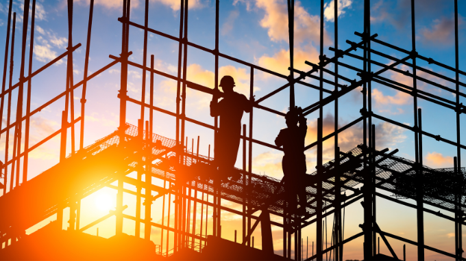 Workers constructing a building