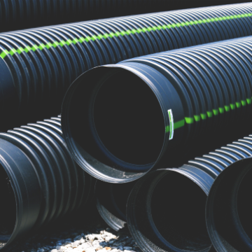 A stack of large drainage pipes.